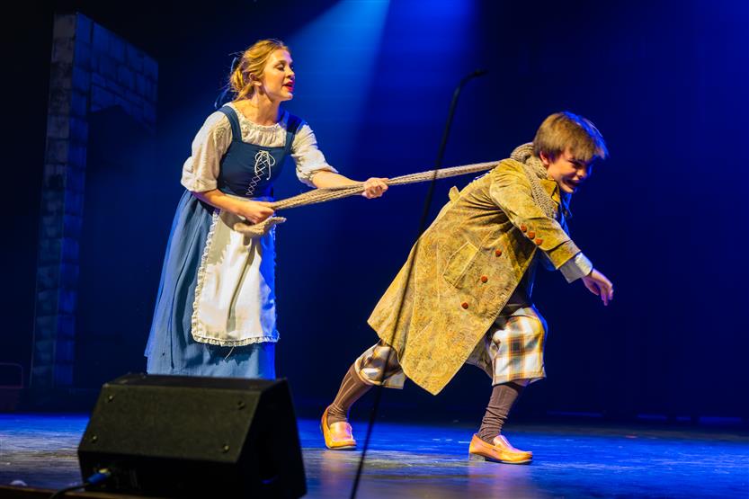 Actors perform onstage
